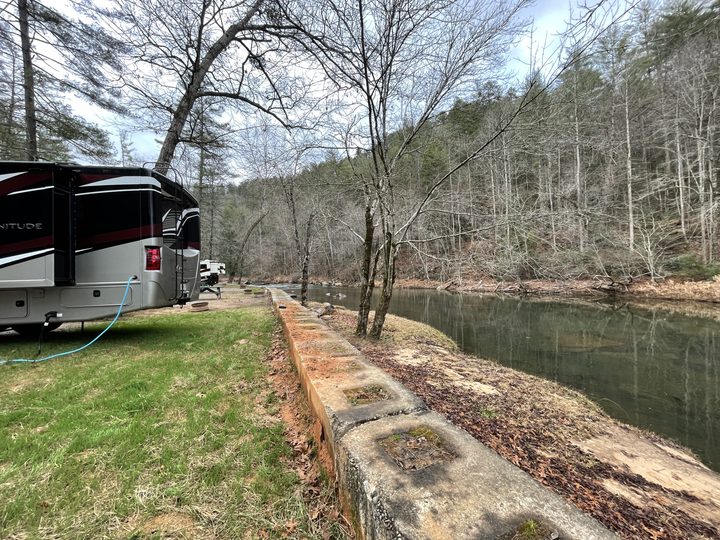 The motorhome parked by a river